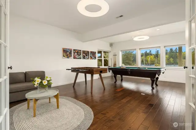 Rec room with lots of space to accommodate whatever your hobby might be.  Pool table will convey if desired.  Look at that view!!