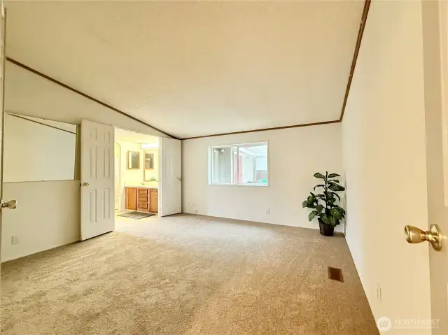 Oversized primary bedroom with walk-in closet and ensuite.