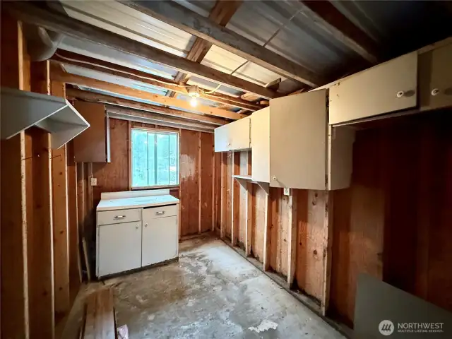 Inside of storage building in back of carport.