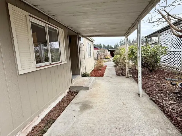 Covered front porch with enough room for entertaining.