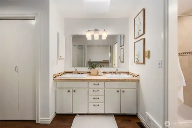 The primary suite bathroom has a walk through closet and 3/4 bath with walk-in shower