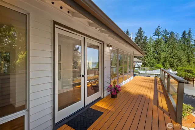 Enjoy views and relaxation from this expansive wraparound front deck, offering serene scenery from every angle.