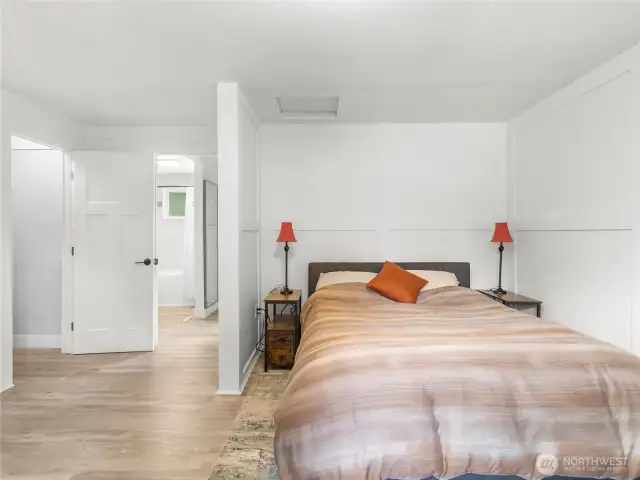 Bed nook protects sleepers from hallway light and a breeze-way leads to the primary bath and Walk in closet