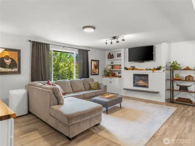 Luxe LVP throughout this South facing living room. Sunlight!