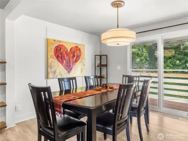 Large dining area and access to deck and backyard.