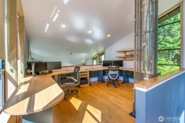 The loft is a multifunctional space, currently furnished as an office.