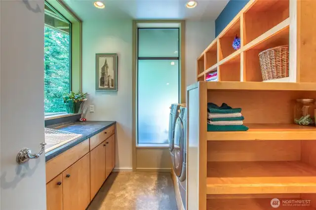 The laundry has full sized machines and storage built-ins.