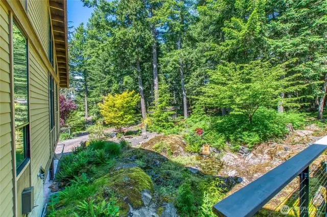 There is a pond with a flowing water feature.