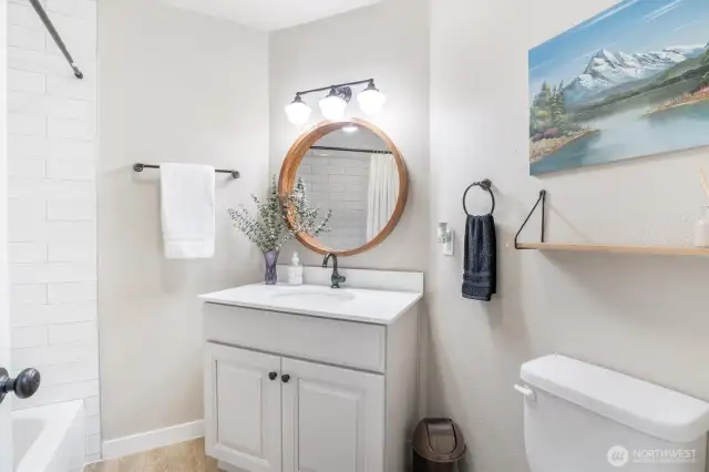 Full main bath with tile bath enclosure