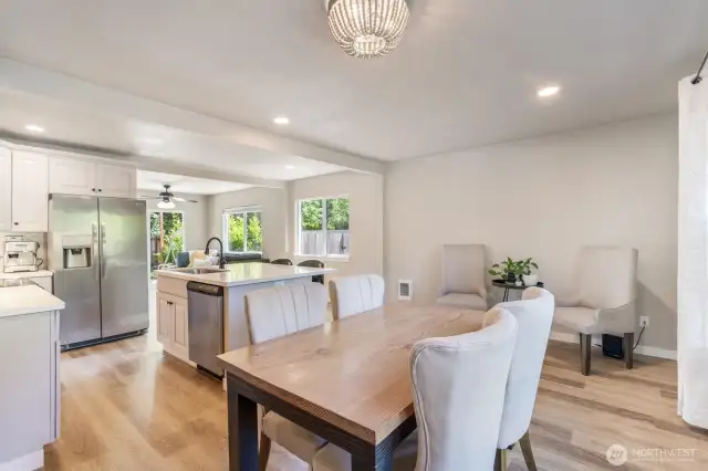 Looking from the dining area to the beautiful island kitchen. Notice the great laminate flooring throughout.
