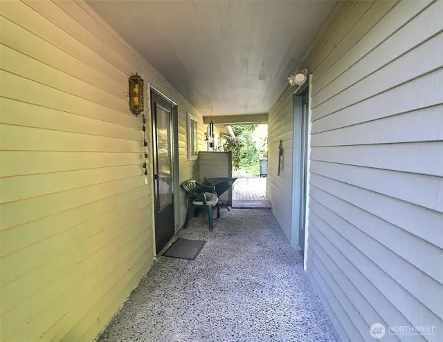 Covered area between house entry and detached garage