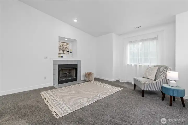 Living room on upper level at the top of the home.
