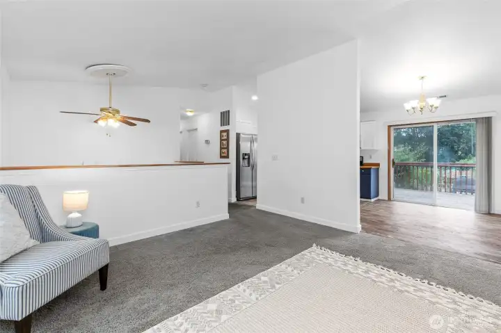 Living room looking on to kitchen eating space.