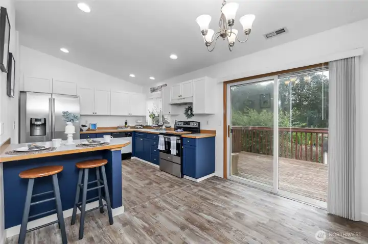 Slider leads to deck off kitchen.