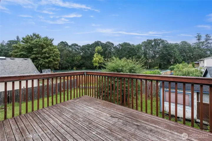 Deck looking out over back yard and basketball court.