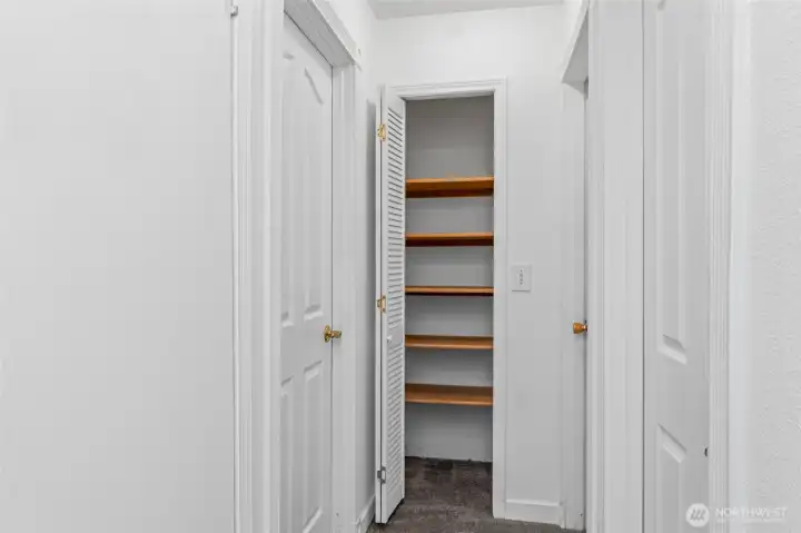 Upstairs hallway with linen closet.