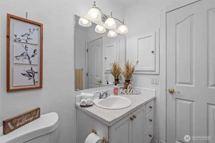 Primary bath with door to hallway.