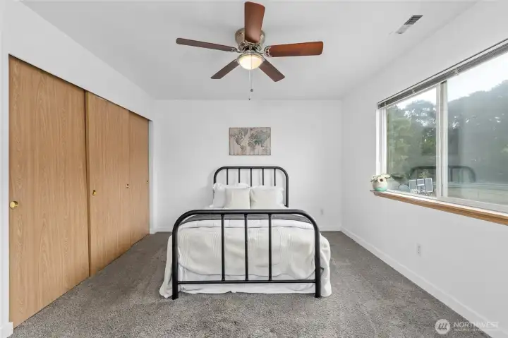 Primary bedroom with extended closet.