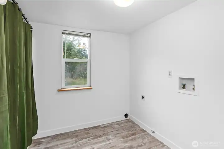 Laundry room downstairs with full bath.