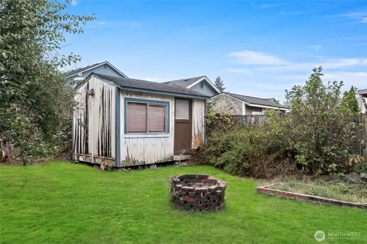 Fire pit and garden shed.