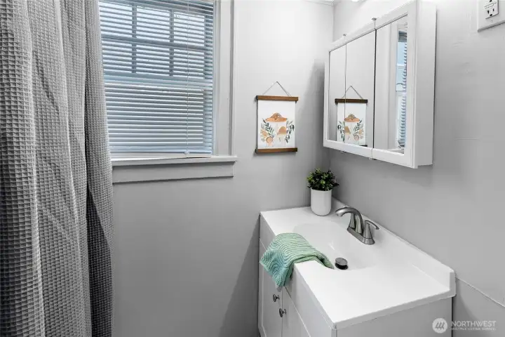 One updated bathroom in the lower unit