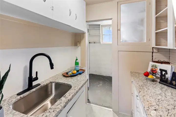 Head through the kitchen to the lower unit utility area