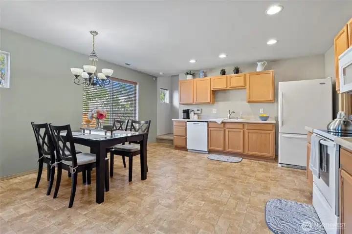 Spacious kitchen with eating spaces and a slider to your fenced backyard.