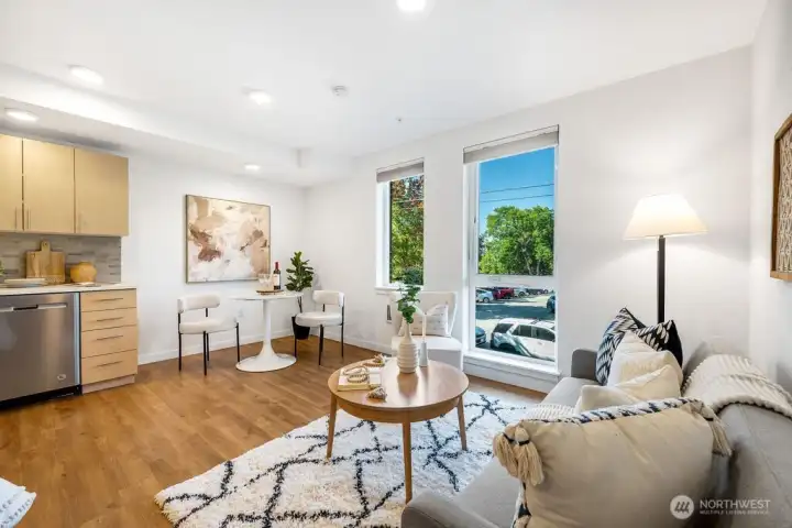 Bright live, work area that lives bigger with high ceilings. Hard wood floors throughout.