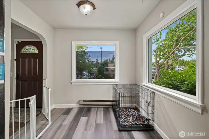 Dedicated dining room is light & bright thanks to large windows. Versatile space could become an office or playroom, tons of potential.