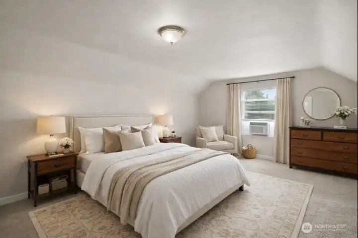 Spacious primary bedroom with fresh paint. Virtually staged.