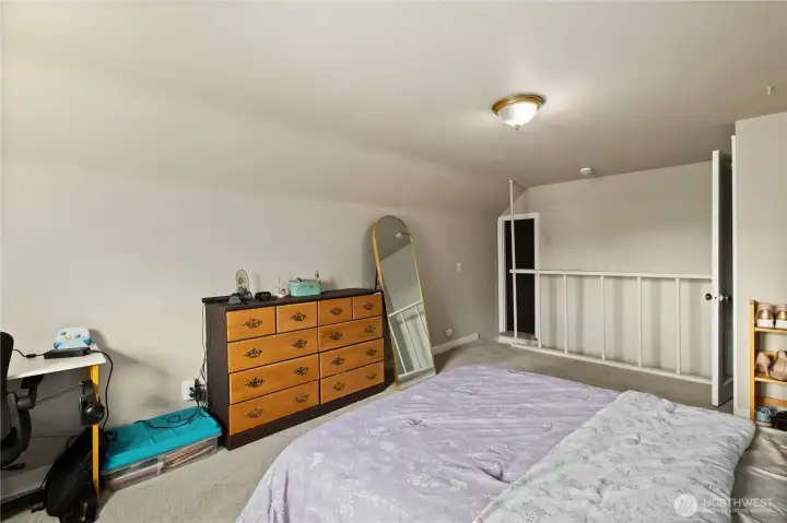 Spacious primary bedroom with fresh paint.