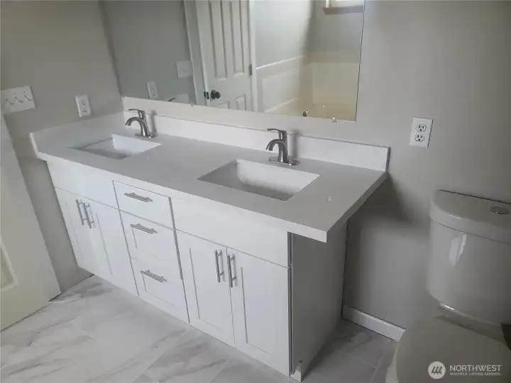 Primary bath showing new double vanity