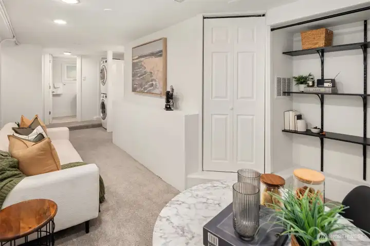 Another view of the bonus space. Door to the left of shelving hides furnace and hot water tank.