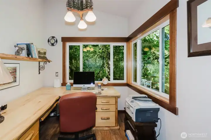 Office overlooking salmon-filled creek with door to deck