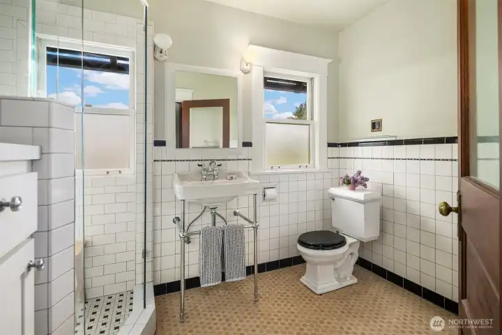 Second upstairs bath features a very roomy shower.
