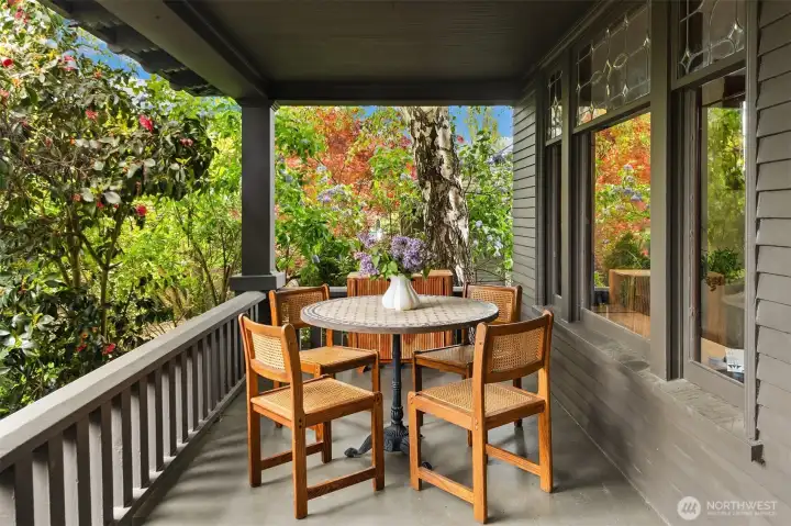 The front porch is one of the Seller's favorite places to have his meals or coffee with friends.
