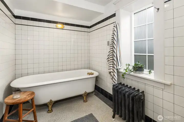 The tub area in the LARGE wet room bath. The shower is opposite the tub.