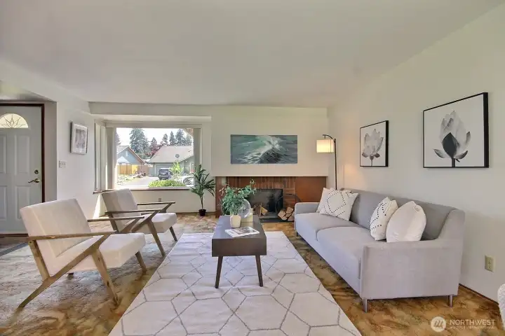 Cozy up by the wood burning fireplace in the spacious front living room — perfect for chilly PNW evenings.