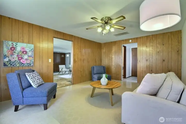 A bright and open family room with plenty of space for gathering, hobbies, or a media setup.