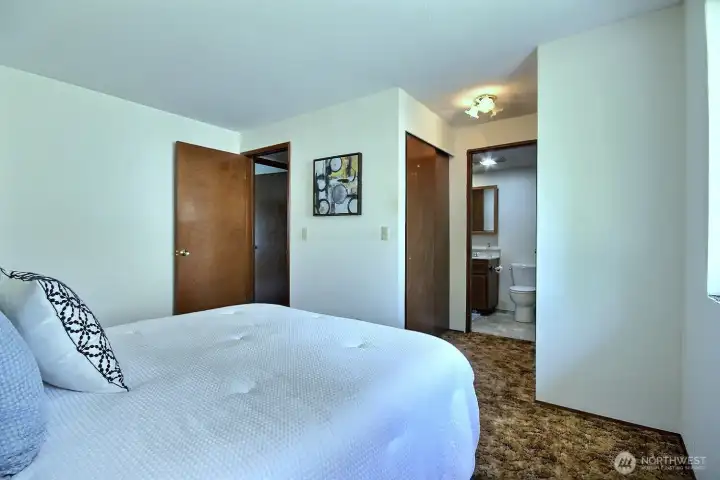 The primary features dual closets and convenient private bath access.