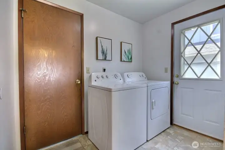 The laundry room offers easy outdoor and garage access — perfect for busy everyday living