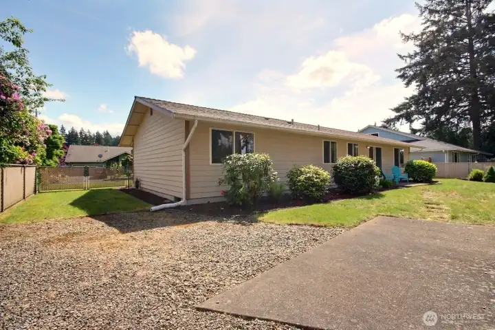 Easy access the backyard, detached garage/shop and dedicated RV parking space
