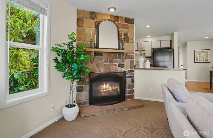 This cozy fireplace is ducted to provide added heat to the upstairs.