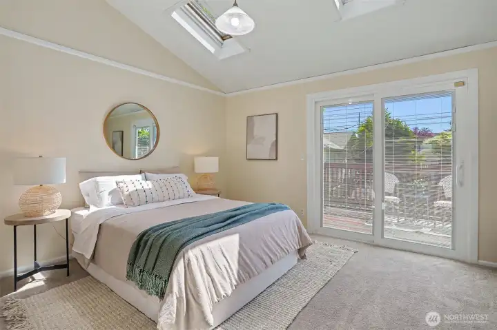 Main floor bedroom has multiple skylights.