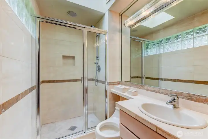 This primary bathroom features a 3/4 shower and is ready for your personal touch or a refreshing update.