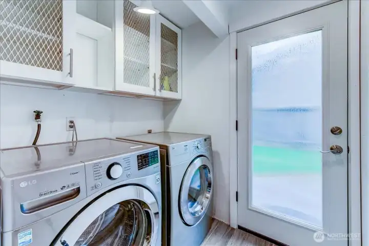 Laundry and mud room area featuring convenient storage and utility space.