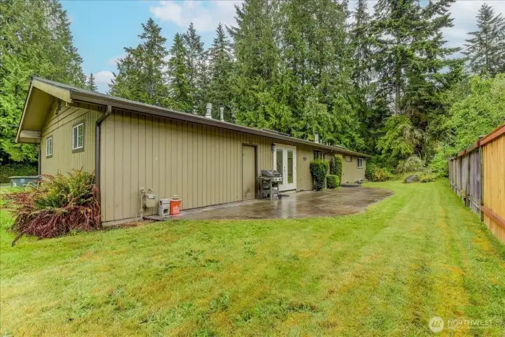 Spacious patio and backyard perfect for outdoor entertaining and hosting guests.
