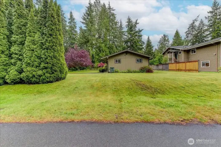 Large side yard with plenty of potential for garden space, recreational use or future expansion.