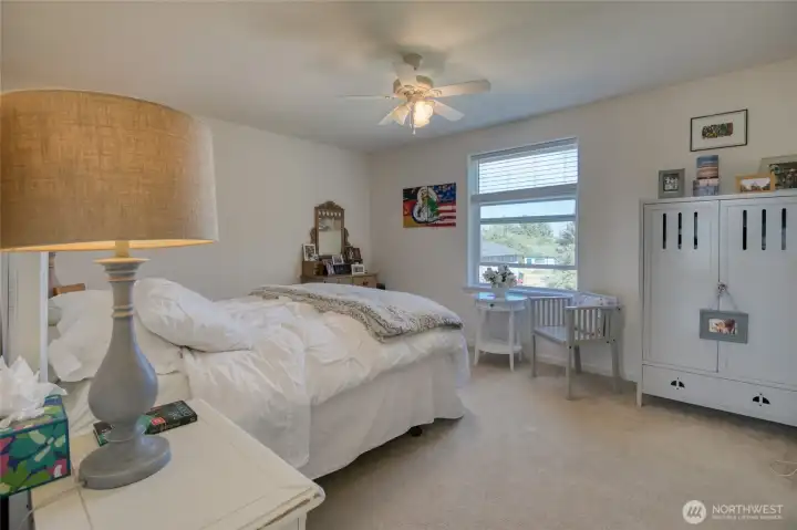 Step into the main floor primary bedroom.