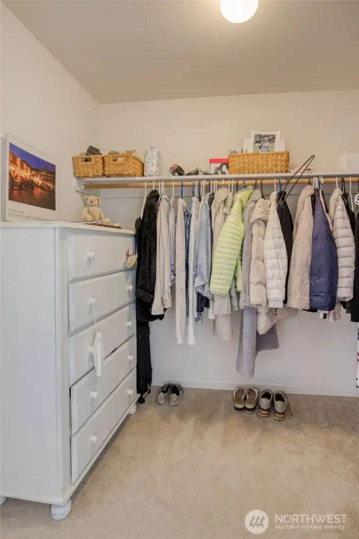 Main floor primary walk-in closet.